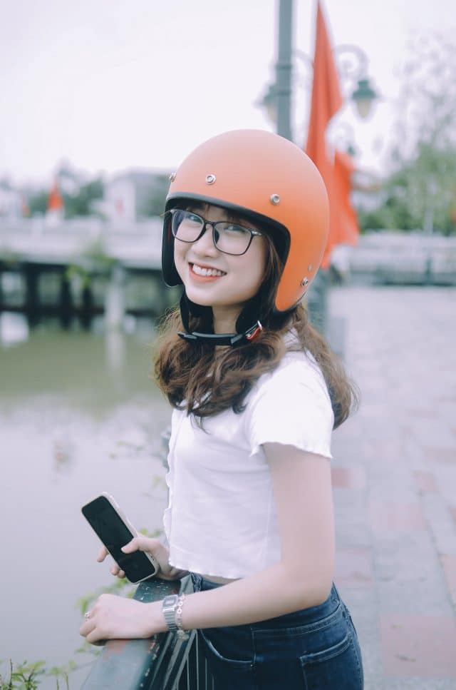 vietnamese girl in orange helmet